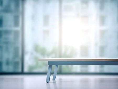 Creative mock concept. Empty blue wooden table top in front of living room high rise building in retro style blurred background. Template for product presentation display.の素材
