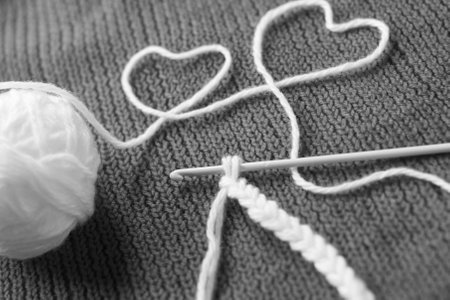 knitted fabric, black and white background, two heartsの写真素材