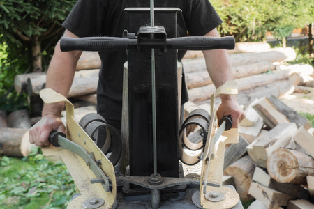 Firewood split with wooden splitterの写真素材