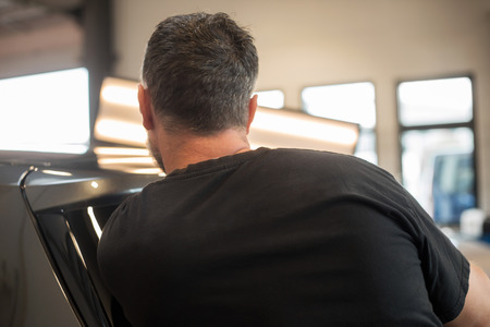 Repairing dents in a carの写真素材