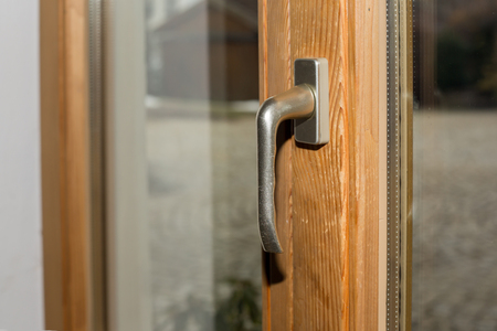Handle of a patio door made of woodの写真素材