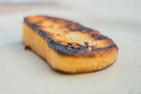 Toasted slice of white bread from the grillの写真素材