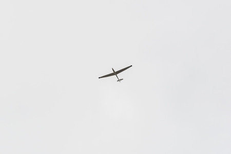 A single glider in the sky without clouds