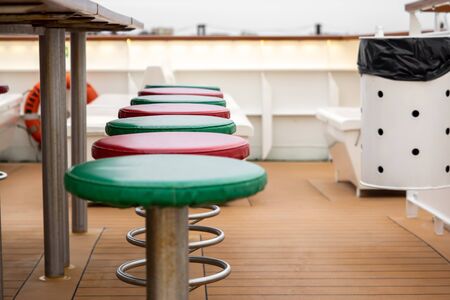 Leather-covered chairs on the deck of a shipの写真素材