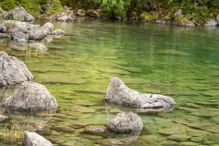 View on stones at the Eibseeの写真素材