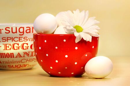 Eggs in red polka dot bowl on counter