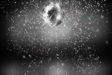 Disco ball with lights and confetti party backgroundの写真素材