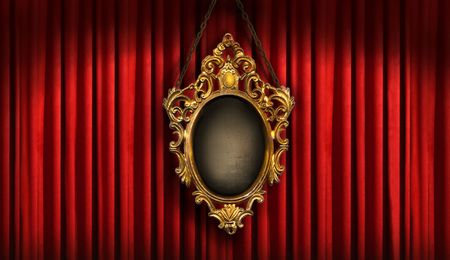 Red drapes with old gold frameの写真素材