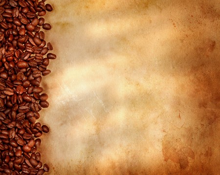 Coffee beans on old parchment paperの写真素材
