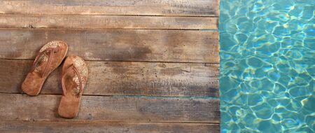 Brown sandals on withered wood の写真素材