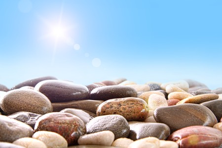 Pile of river rocks on white backgroundの写真素材