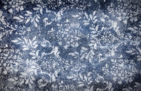 Grungy denim with faded floral effect backgroundの写真素材