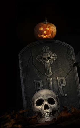 Spooky tombstone with skull and pumpkin on black backgroundの写真素材