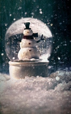 Snow globe in a snowy winter settingの写真素材