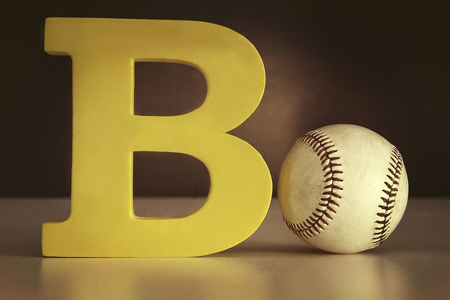 The letter B with a basecball on tableの写真素材