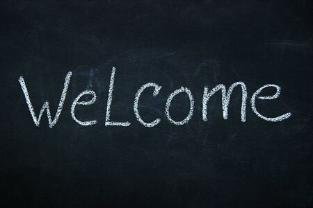 Word written in white chalk on blackboardの写真素材