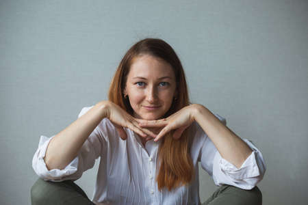portrait of a girl, a woman who covers her face with her hands