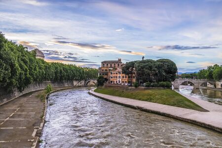 Italy, Rome, 04 May 2014 - Tiber Island at the sunrise, low light shot taken from Ponte Garibaldi on Tiber Riverのeditorial素材
