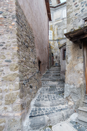 Italy, Anguillara Sabazia - January 31, 2016: Anguillara is a small medieval town overlooking Bracciano Lake; its streets are narrow and steep and seems to go back five hundred yearsの写真素材
