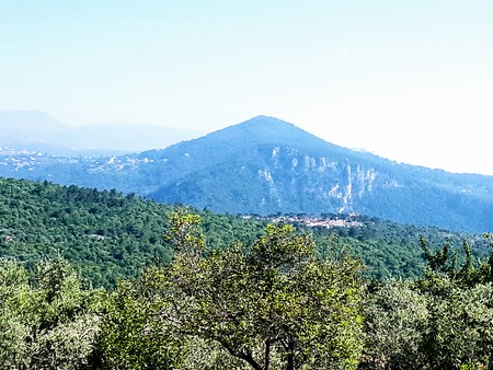 A mountain view from Mount Lebanon consisting of multiple mountains that are filled with trees and greenery.の写真素材