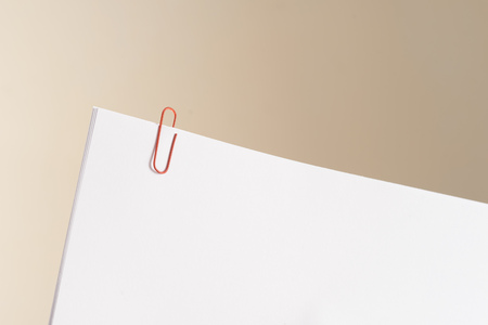 Some white papers clipped together. Represents reminders, documents or work papers.の写真素材