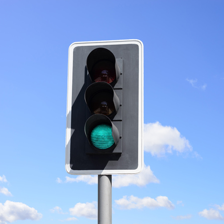 Important traffic sign for vehicles and pedestrians. The green light means go ahead!の写真素材