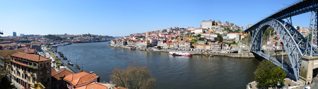 Beautiful River Douro in the city of Porto in Portugal. The bridge that appears to the right is the Don Luis that connects the City of Porto to Vila Nova de Gaia.の写真素材