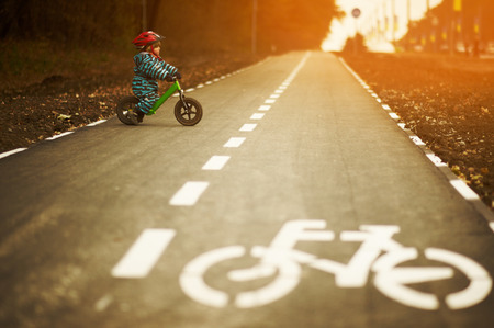 Little boy riding a balance bikeの写真素材