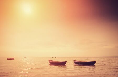 Fishing boats at sunriseの写真素材