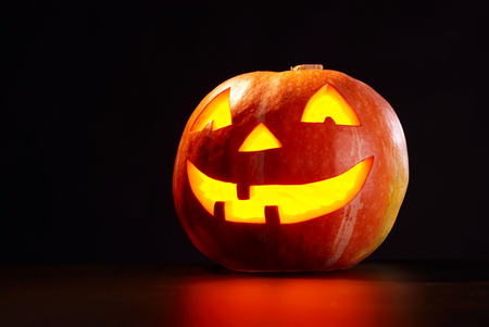 Kind Halloween Pumpkin On A Black Backgroundの写真素材