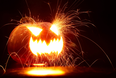 Halloween Pumpkin with sparksの写真素材