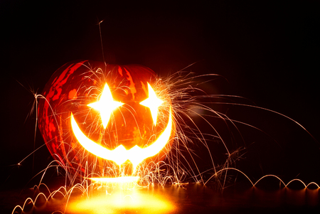 Halloween Pumpkin with sparksの写真素材