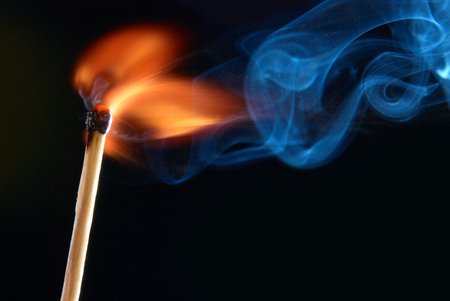 Match with smoke and fireの写真素材