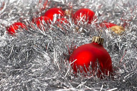 Christmas beautiful red balls on silver backgroundの写真素材