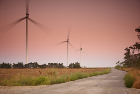 Wind turbines at sunsetの写真素材