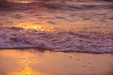 Soft wave of sea at sunsetの写真素材