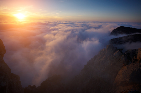 View of misty fog mountains at sunsetの写真素材
