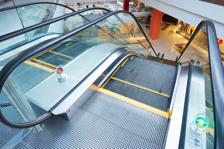 escalator and empty modern shopping mall interiorの写真素材