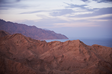 Beautiful landscape with mountains and calm seaの写真素材