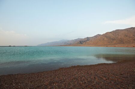 Beautiful landscape with calm sea and villageの写真素材