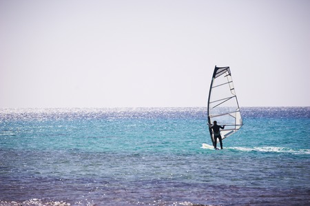 Windsurfing sail on the blue seaの写真素材