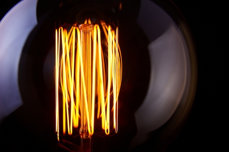classic Edison light bulb on black backgroundの写真素材