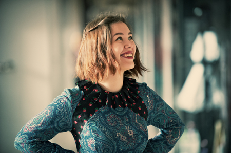 Young smiling woman studio portrait indoorsの写真素材