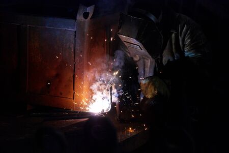 Welders working at the factoryの写真素材
