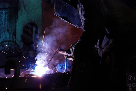 Welders working at the factory