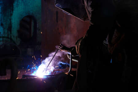 Welders working at the factoryの写真素材