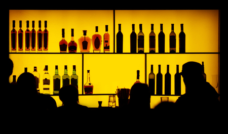 silhouette of people against of a barの写真素材