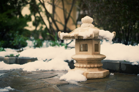 japanese stone lantern at the winter gardenの写真素材