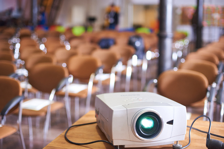 Working projector at the empty conference hallの写真素材