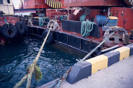 Mooring ropes, The vessel is moored alongside a pier.の写真素材
